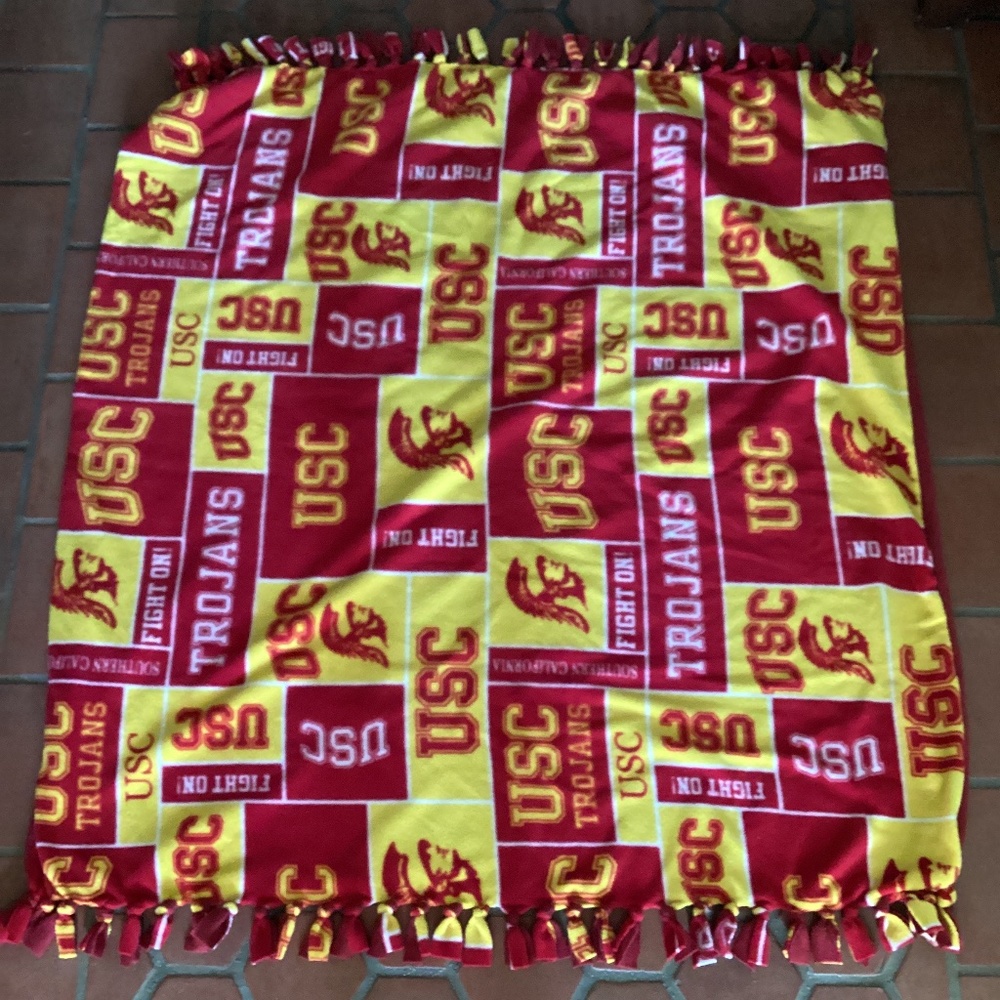 USC fleece blanket.  Approximately 50” x 45”.  Pattern front and solid back.